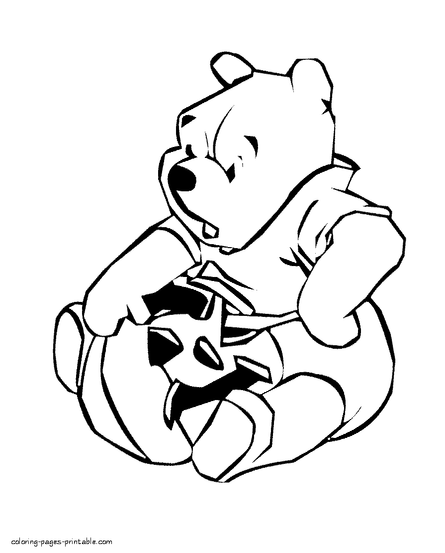Pooh and Halloween pumpkin. Coloring page