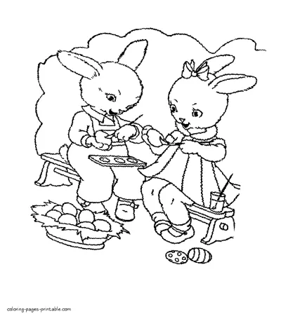 Bunnies decorates the eggs to Easter