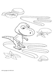 Buddy explores a dinosaur footprint. Coloring page