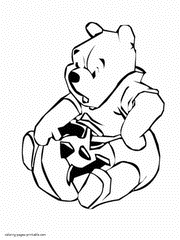 Pooh and Halloween pumpkin. Coloring page