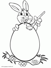 A bunny paints an Easter egg. Coloring page