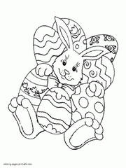 Holiday coloring page. Easter bunny & eggs