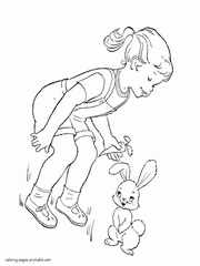 Girl gives a carrot to the bunny